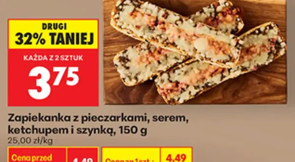 Zapiekanka z pieczarkami, serem i szynką na desce, z promocją 32% taniej.